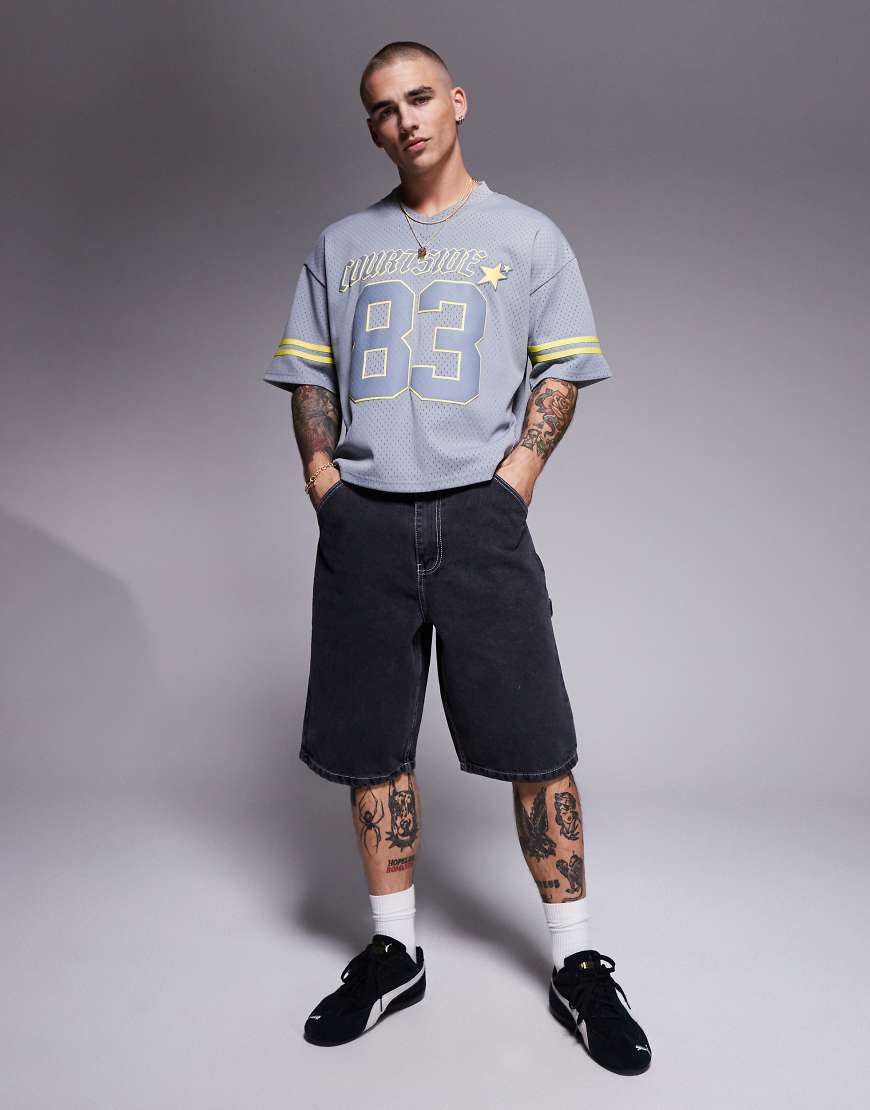 Courtside carpenter denim jort with back pocket embroidery in medium in washed black